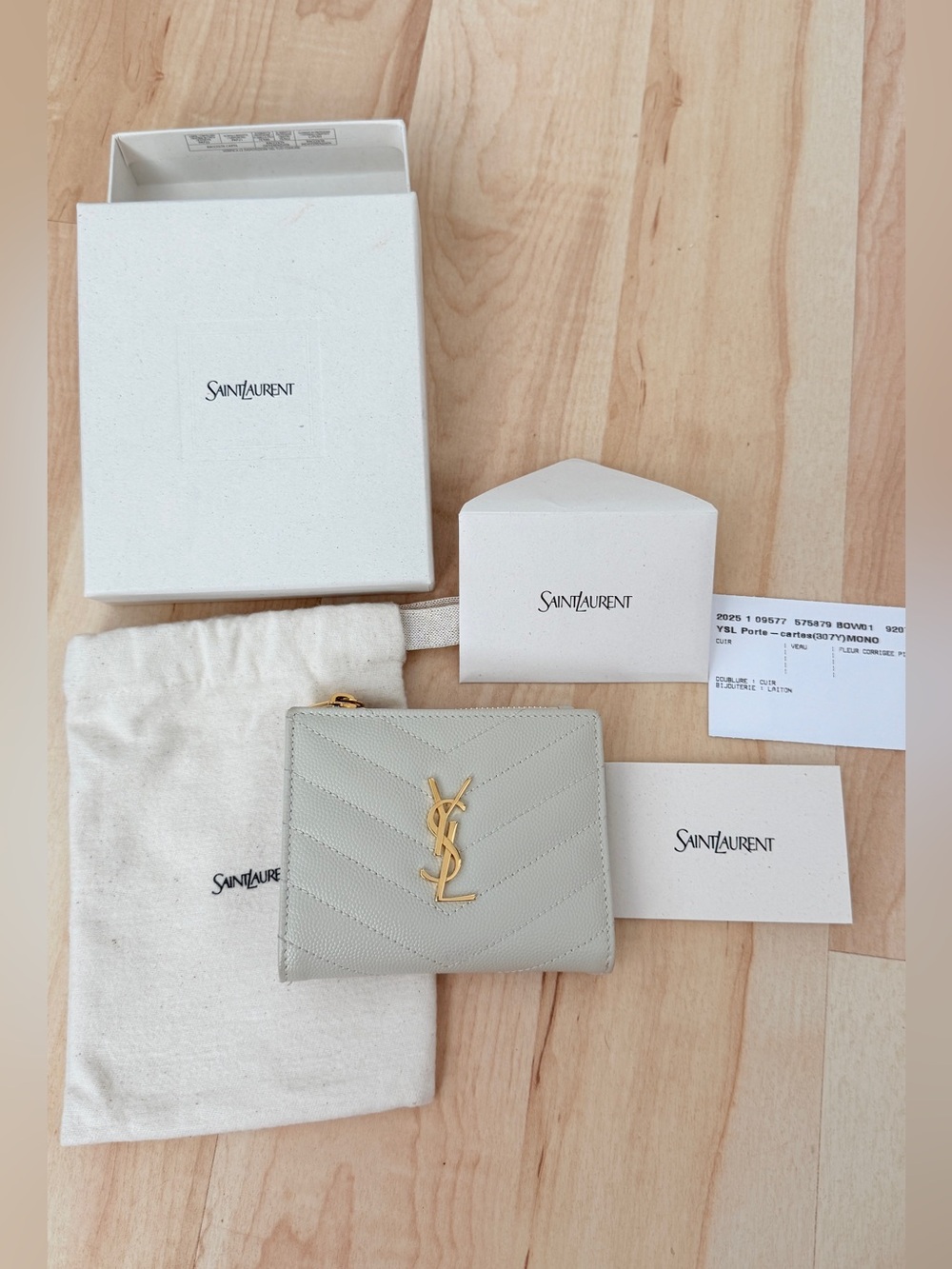 YSL CASSANDRE MATELASSÉ BI-FOLD WALLET IN GRAIN DE POUDRE LEATHER